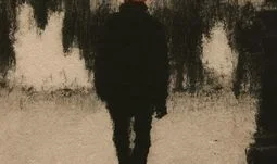 a man in paris with an orange hat