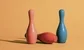 bowling pins, one has fallen over 