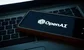 Phone displaying OpenAI logo